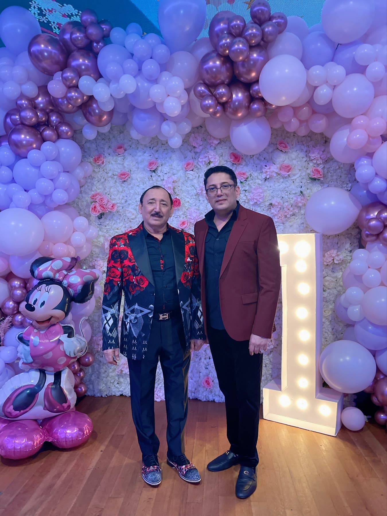 Lazar standing with an event guest