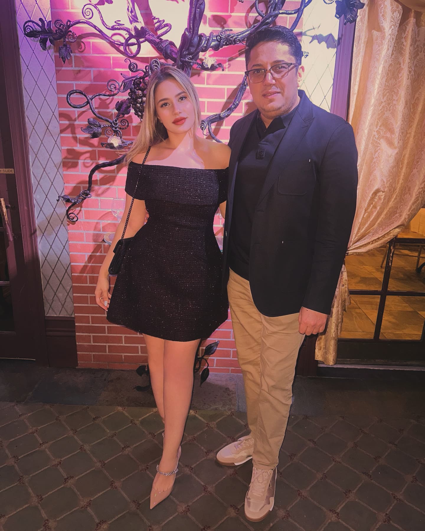 Lazar standing with an event guest