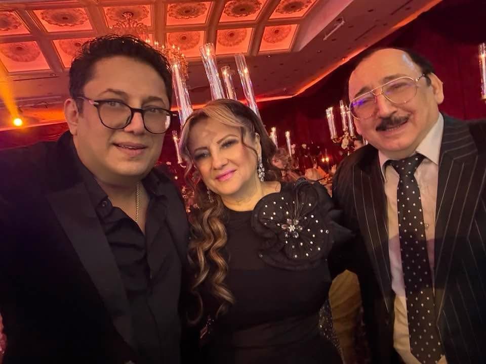 Lazar posing with two event guests