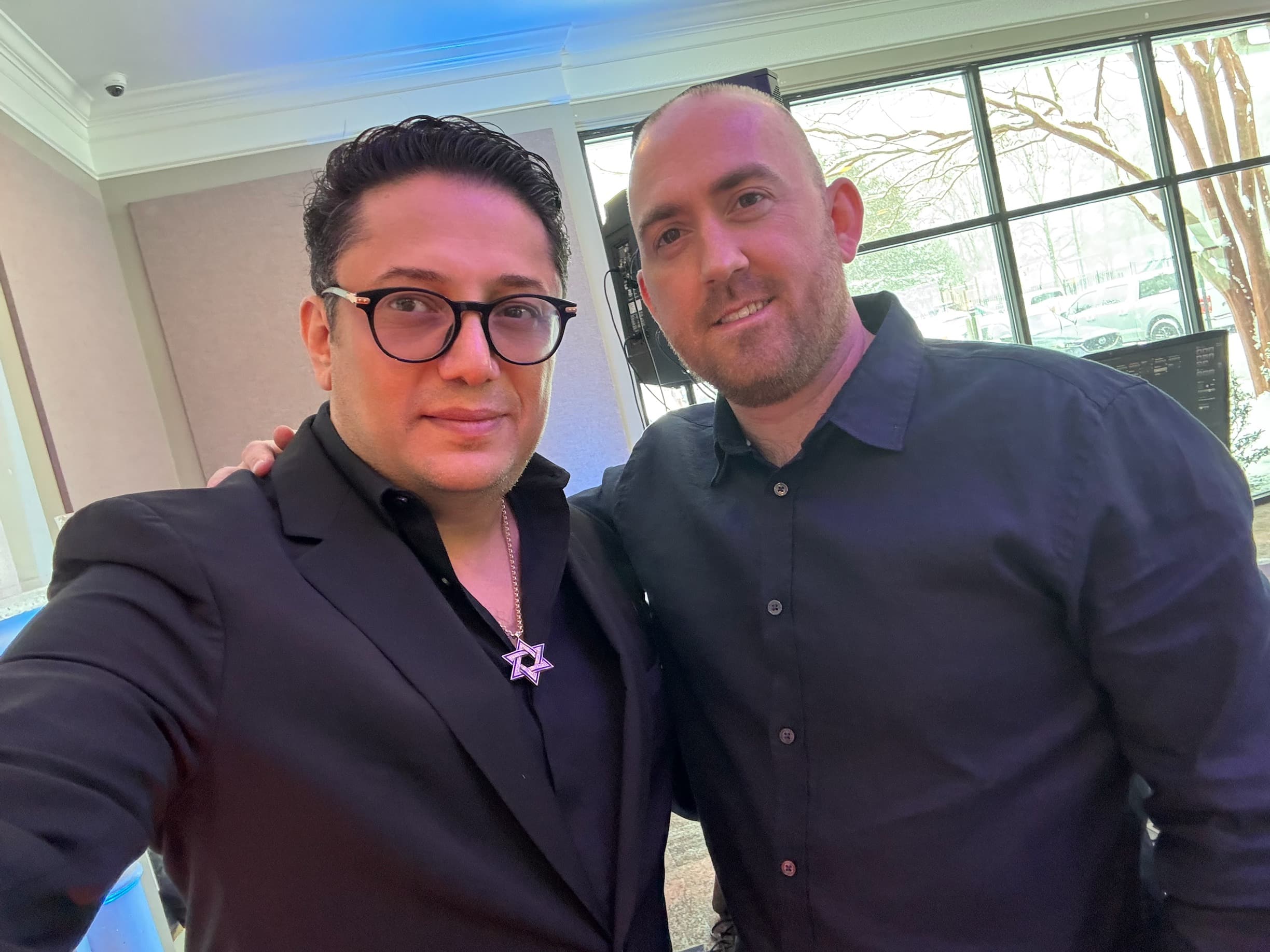 Lazar posing with an event guest
