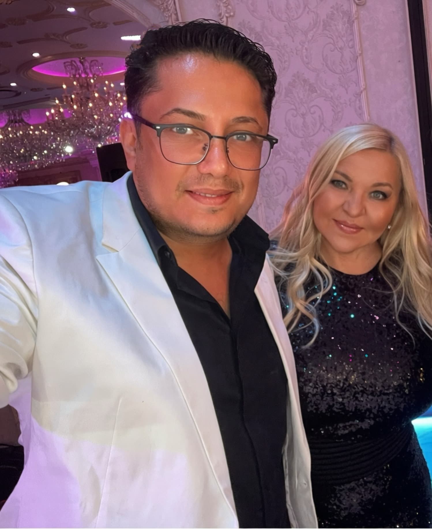 Lazar posing with a woman at an event