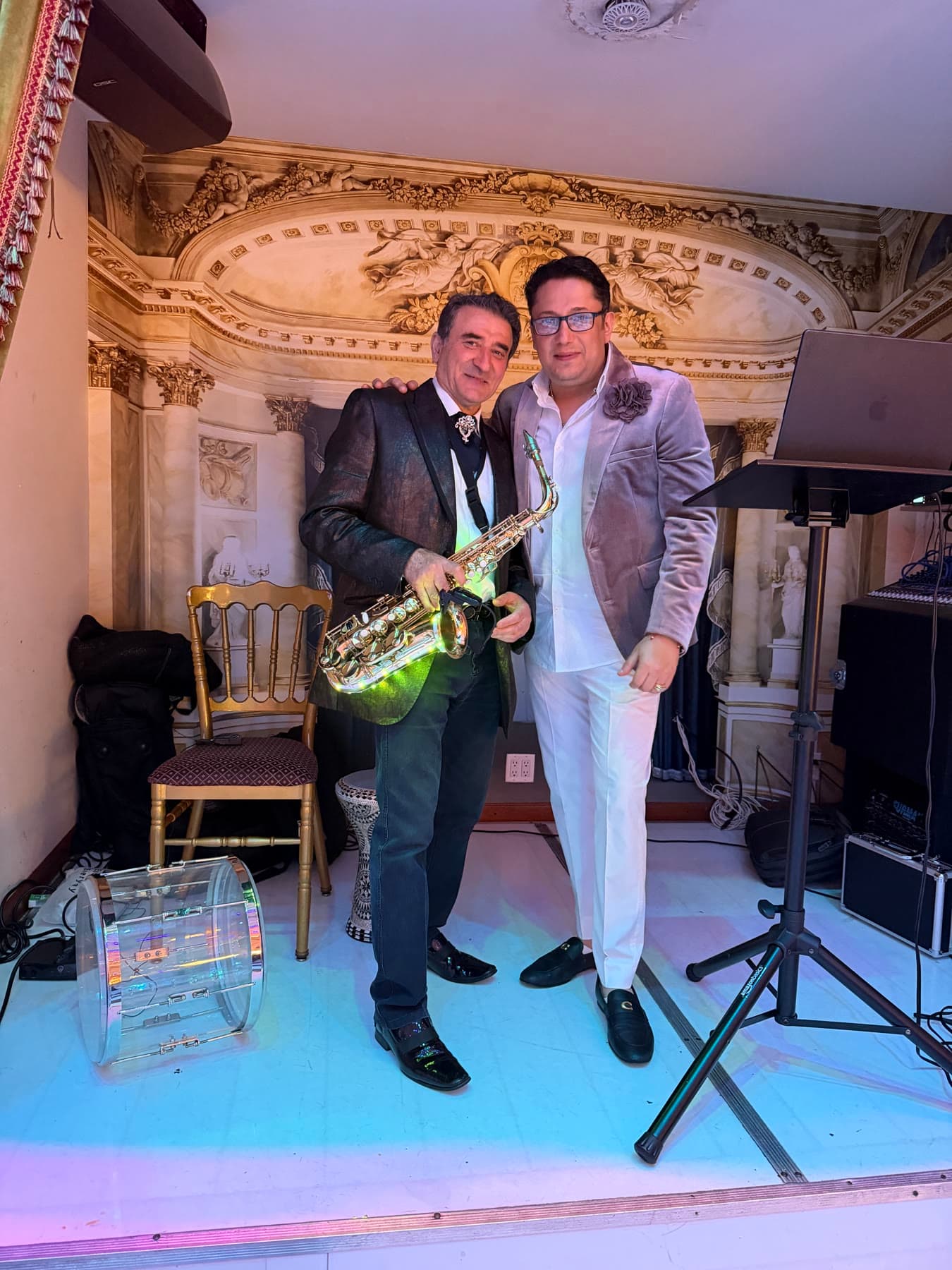 Lazar standing beside a saxophonist