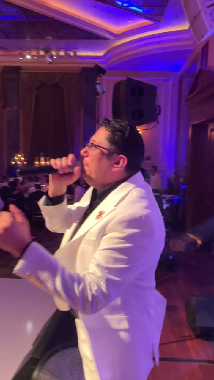 Lazar Barayev hosting a formal event